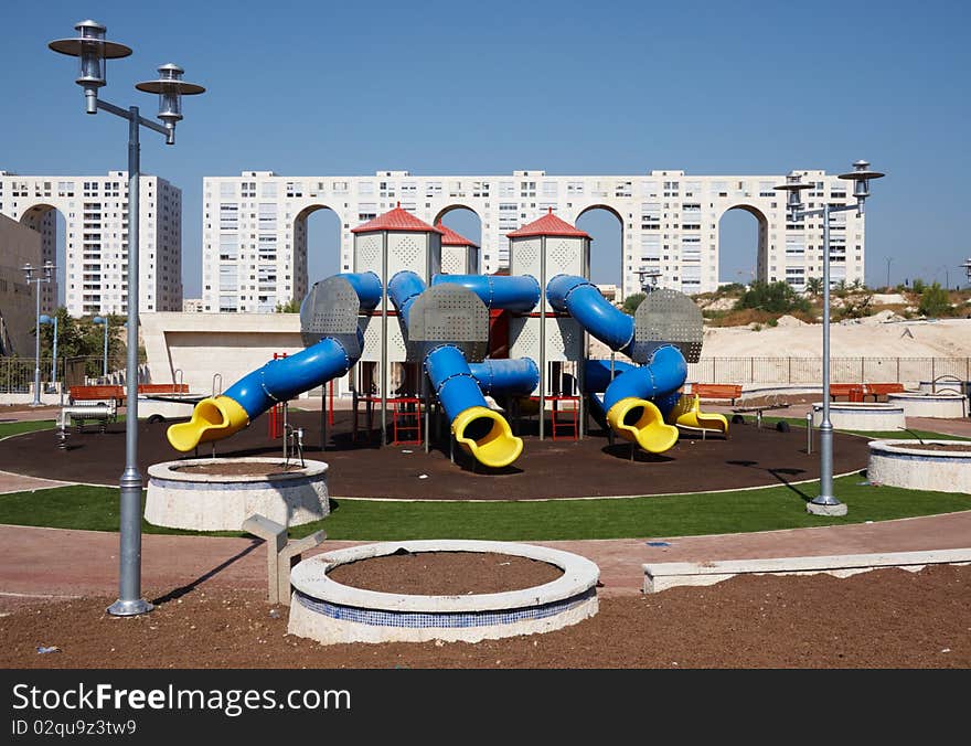 Children playground with home building as a background