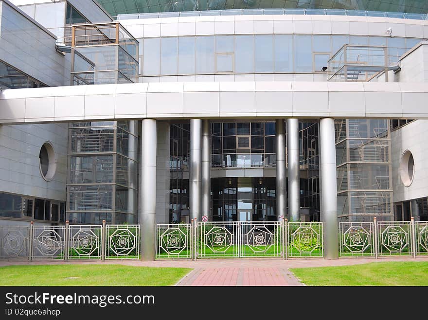 Building from glass and metal with a ladder