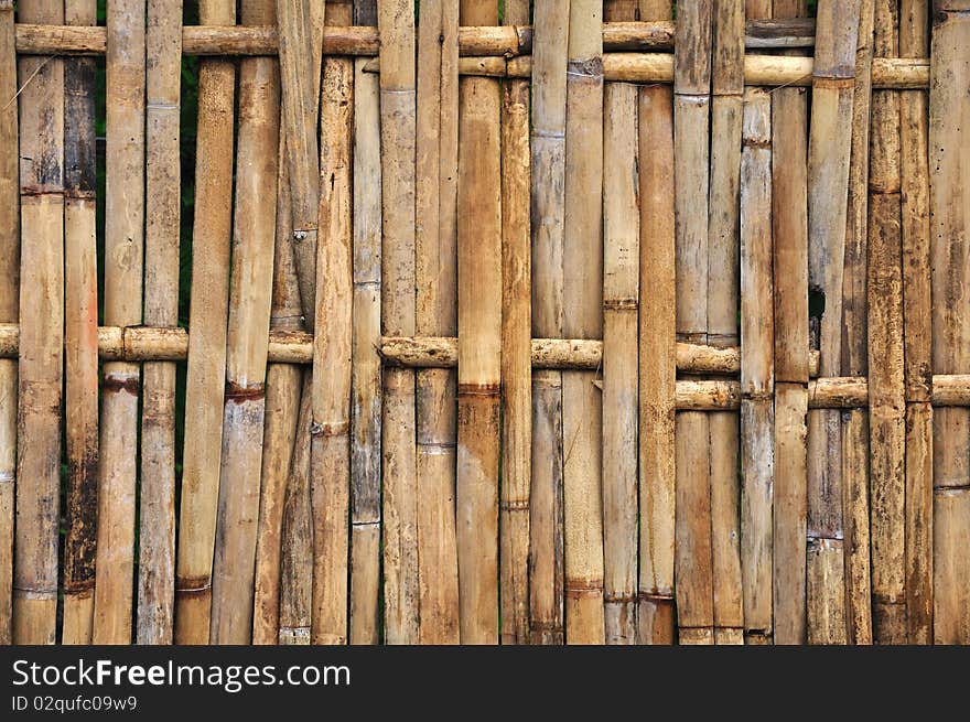 A fence made from bamboo material. A fence made from bamboo material