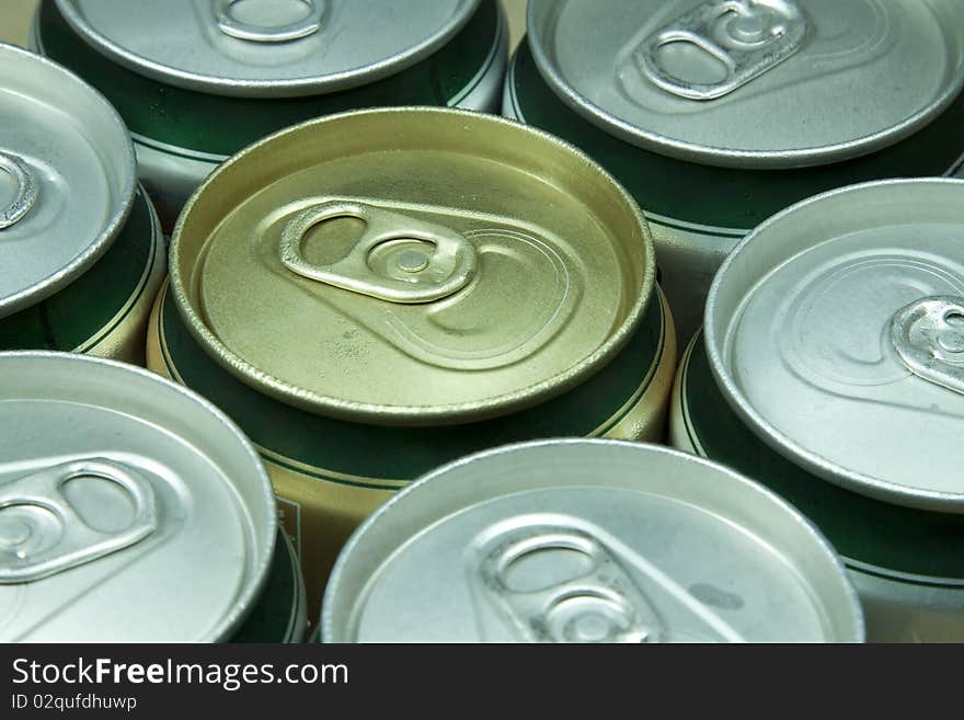 Many cans of beer with water drops