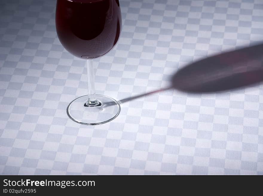 Red wine glass on table