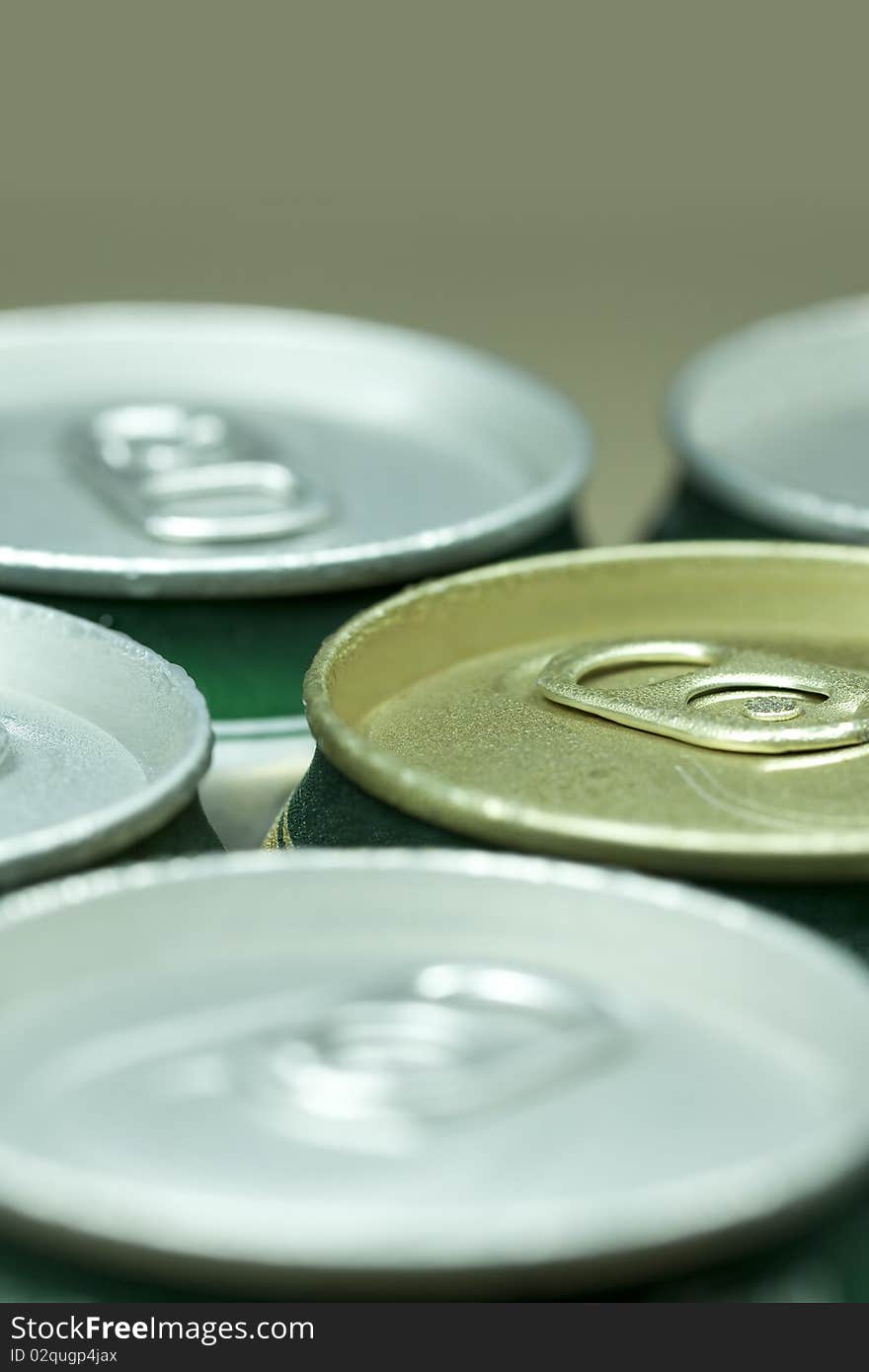 Many cans of beer with water drops