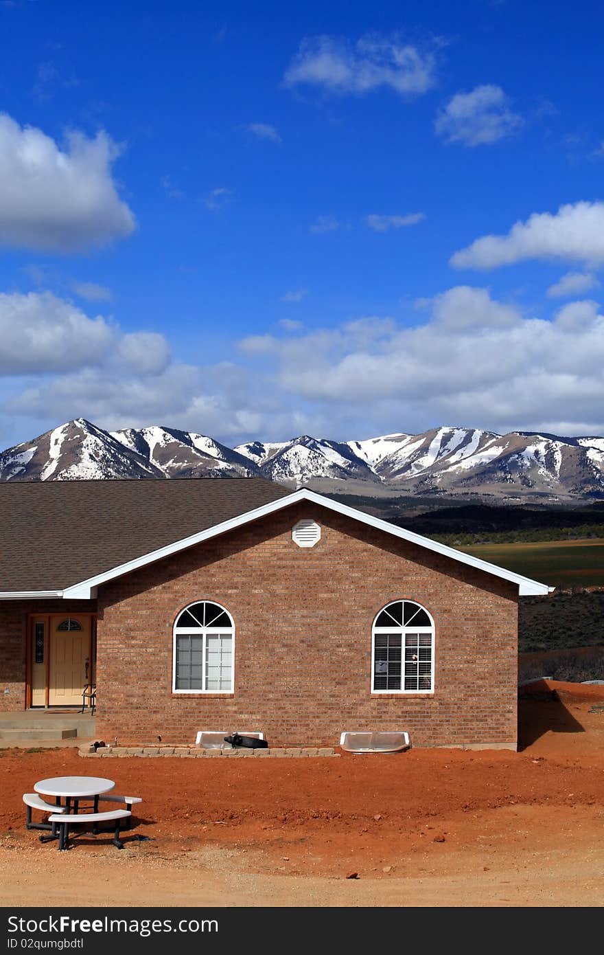 House in countryside with beautiful landscape on background,utah,USA. House in countryside with beautiful landscape on background,utah,USA