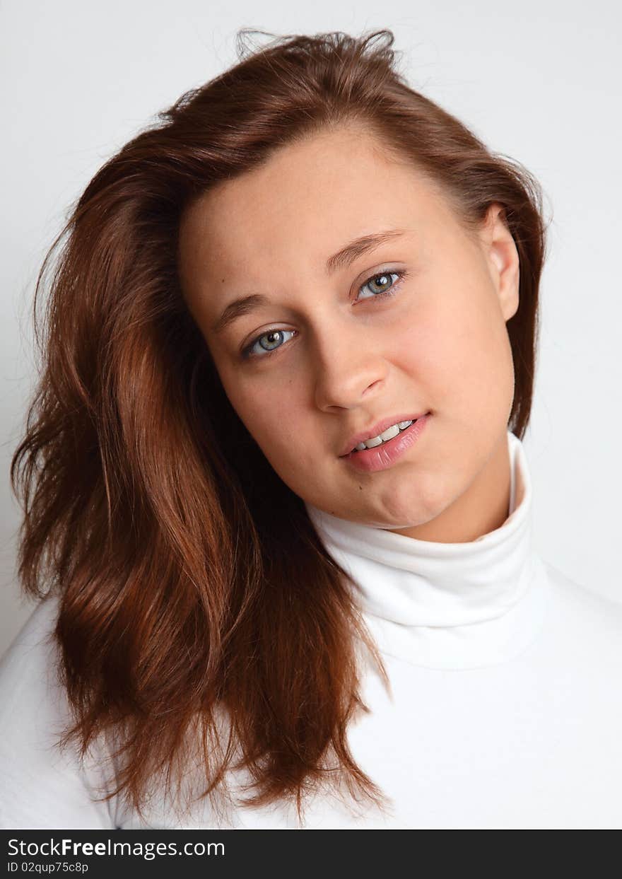 Portrait of the beautiful girl  on a light background