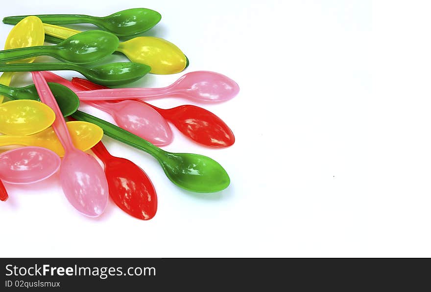 Arrangement Colorful Plastic Spoon with white background. Arrangement Colorful Plastic Spoon with white background