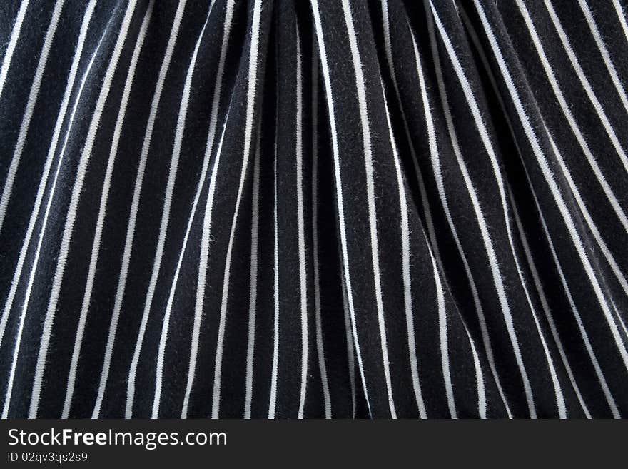 Striped black and white satin fabric background. Striped black and white satin fabric background