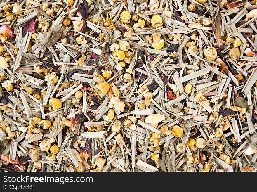 Close up of colorful herbal tea mixture with wild berries & blossoms.