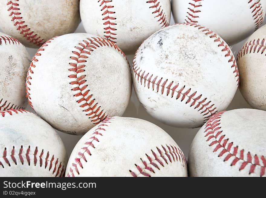 Close up of old baseballs on white background. Close up of old baseballs on white background.