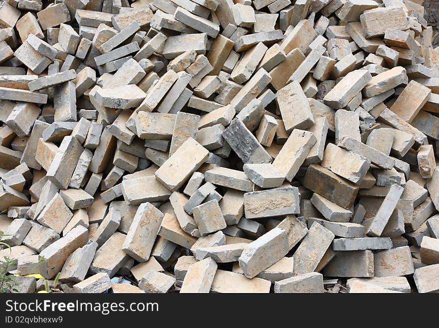 Pile of gray bricks at site of street repair