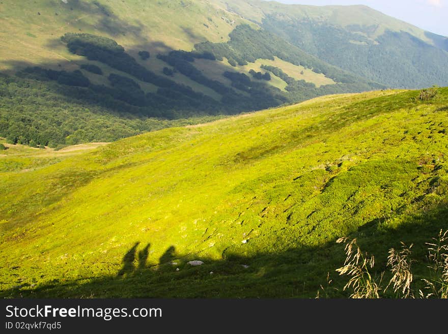 Three shadows of people walking in mouintains. Three shadows of people walking in mouintains