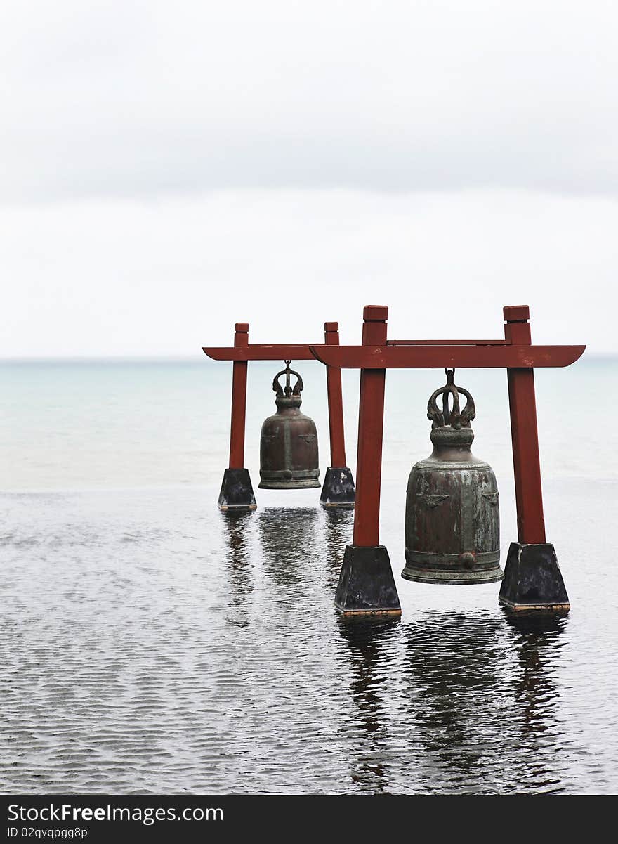 Two old large bells in water