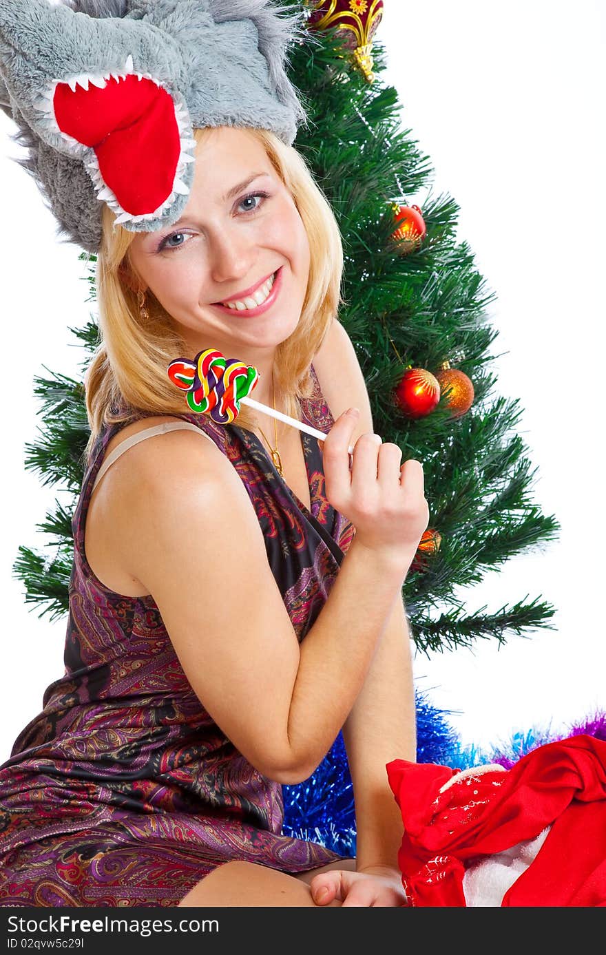 Girl near Christmas fir tree