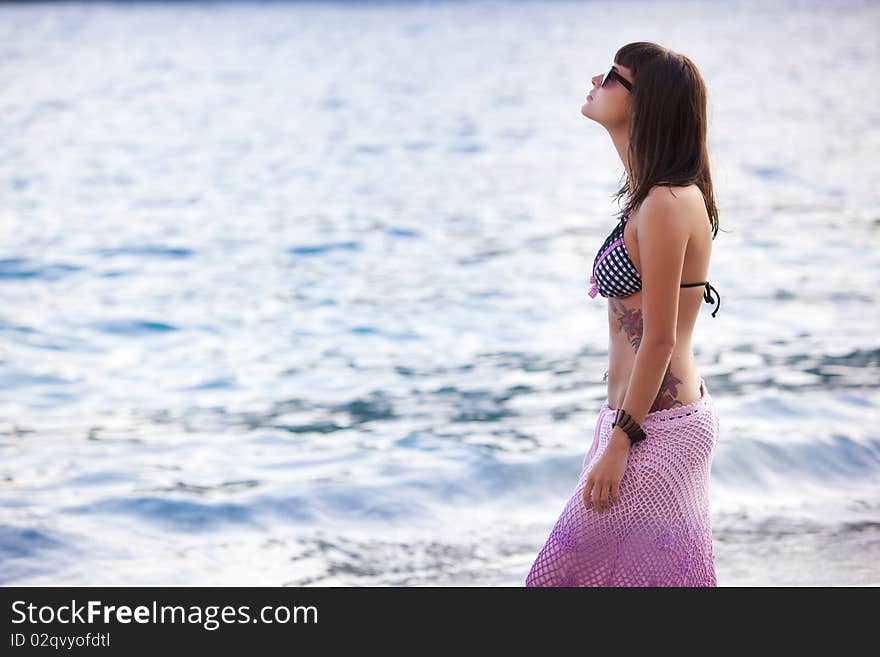 Young beautiful woman wearing fashionable stuff on the beach. Young beautiful woman wearing fashionable stuff on the beach