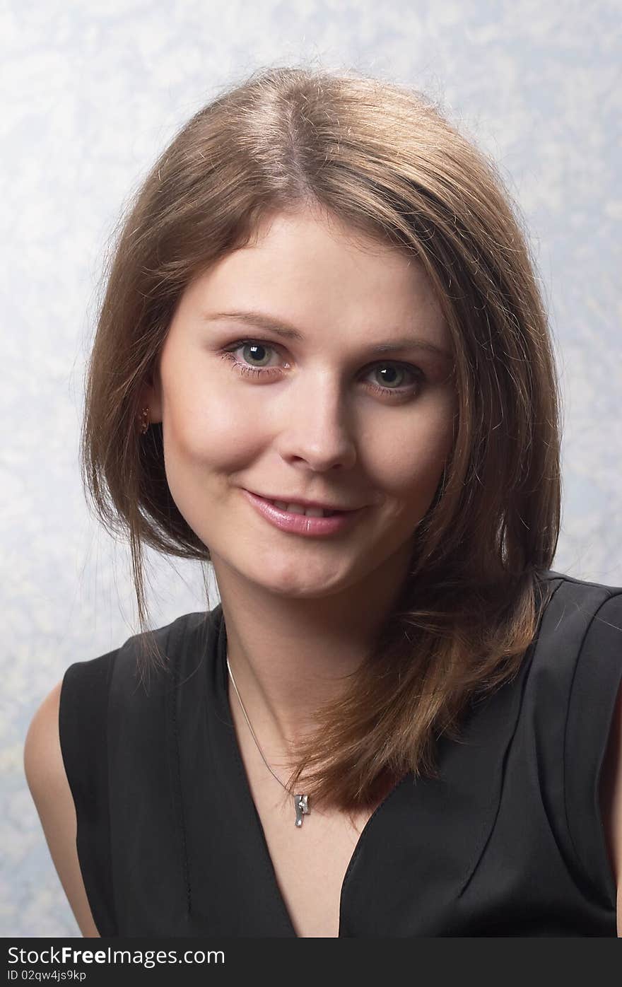 Young woman with makeup over light defocused background. Young woman with makeup over light defocused background