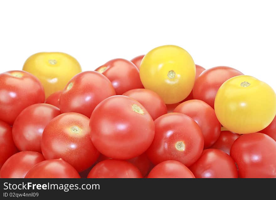 Fresh ripe red and yellow cocktail tomatoes isolated on white