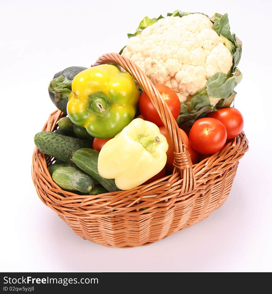 Basket full of vegetables on white background. Basket full of vegetables on white background