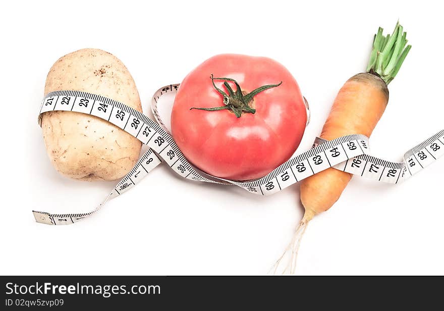 Set of vegetable-related measuring ribbon, shot on white. Set of vegetable-related measuring ribbon, shot on white