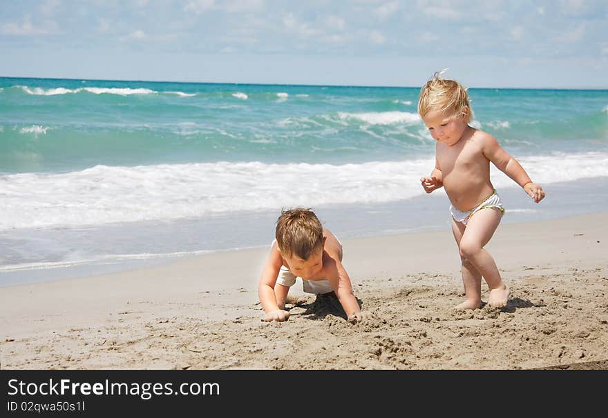 Two kids playing on beach