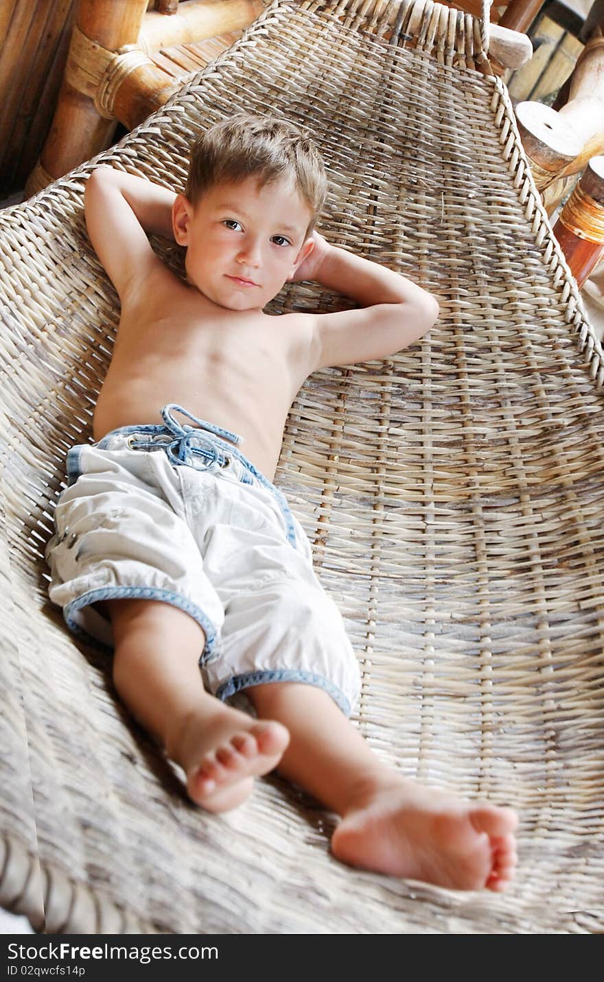 Young boy relaxing in hammock