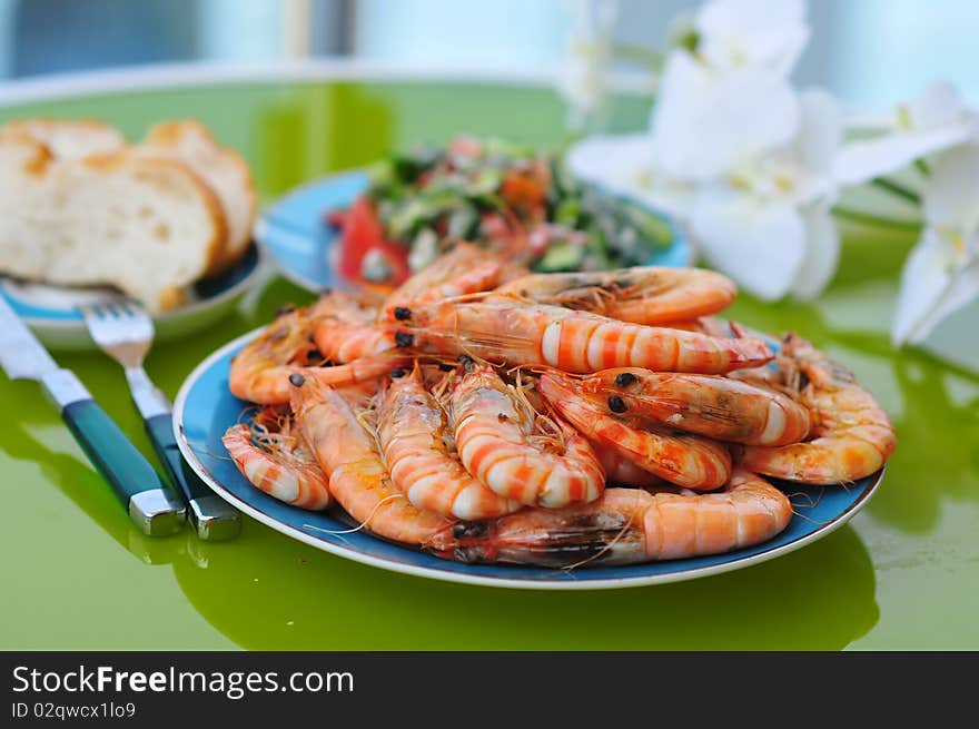 A lot of fried tiger prawns on a plate