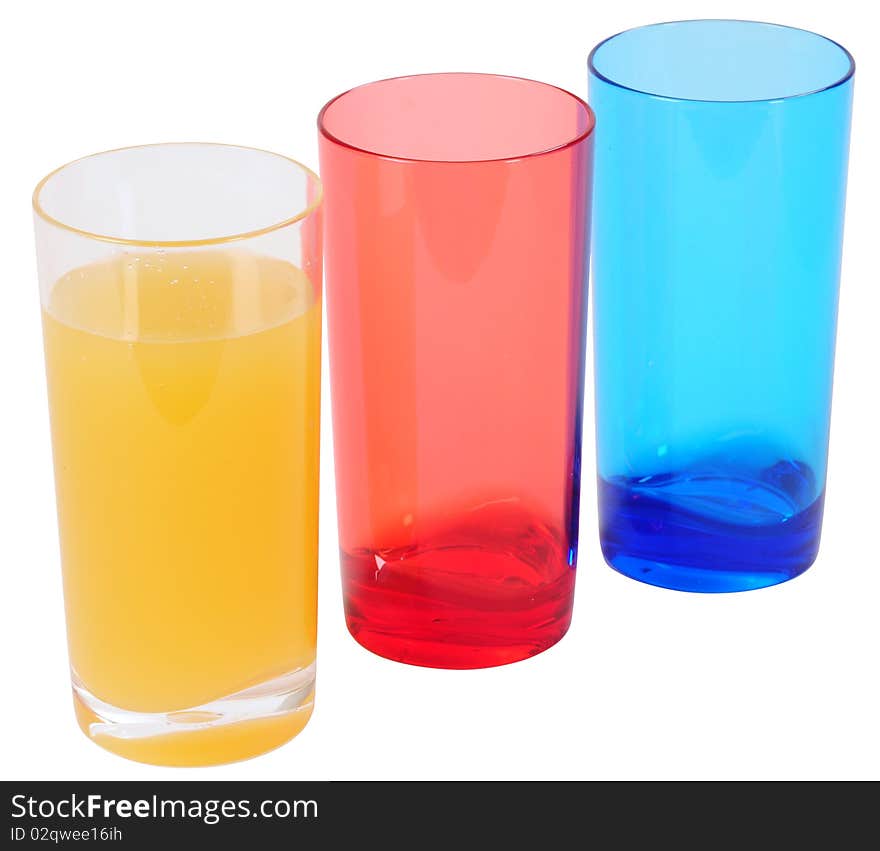 Two empty glasses with one full of orange juice isolated over white. Two empty glasses with one full of orange juice isolated over white.