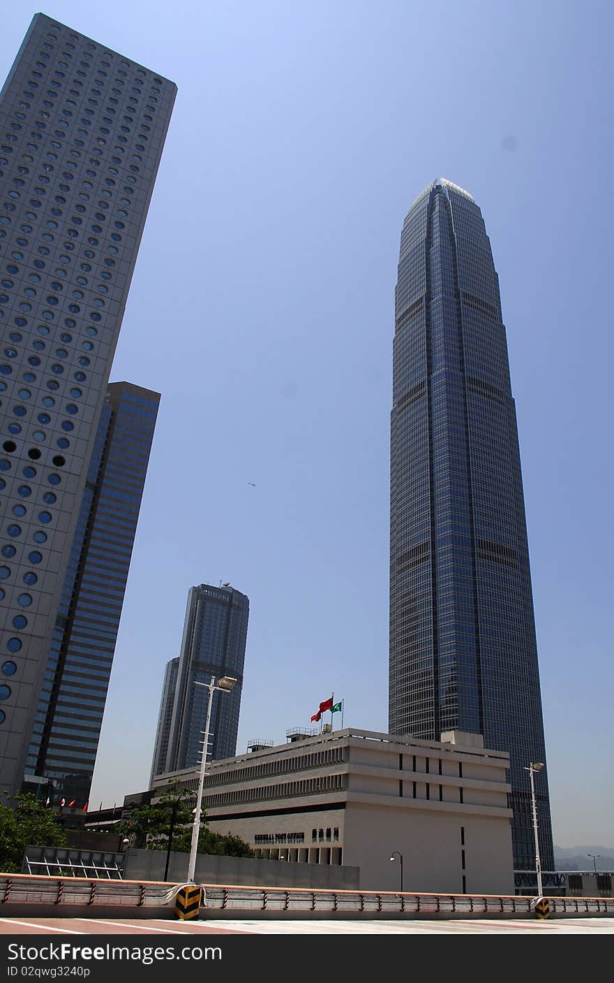 IFC 2 on the right and Jardine House on the left, with round windows, two landmark business buildings in downtown Hong Kong. IFC 2 on the right and Jardine House on the left, with round windows, two landmark business buildings in downtown Hong Kong