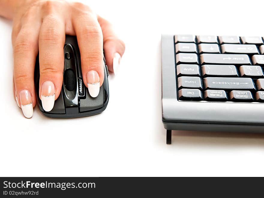 Female hand on computer mouse. Studio shot. Female hand on computer mouse. Studio shot