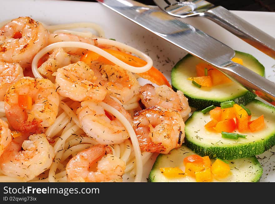 Fresh prepared shrimp with vegetables and pasta. Fresh prepared shrimp with vegetables and pasta.
