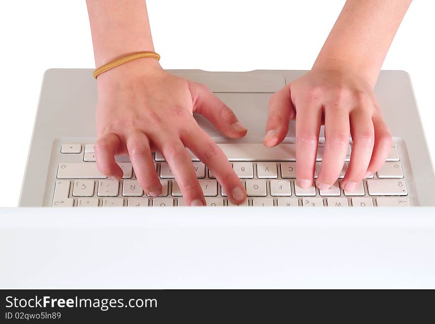 Typing on a white personal computer. Typing on a white personal computer.