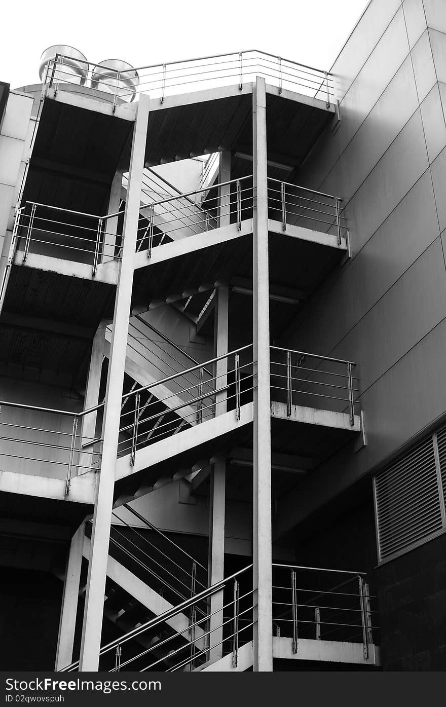 Exterior metallic staircase in an office building. Exterior metallic staircase in an office building.