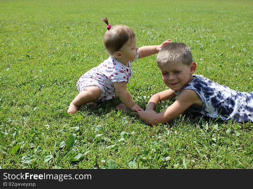 Children play on a grass