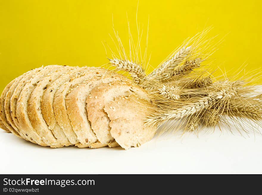 Bread and a few stalks of rye isolated. Bread and a few stalks of rye isolated