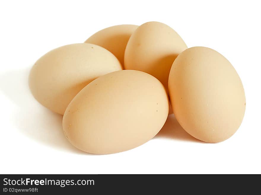 Five eggs isolated on white.