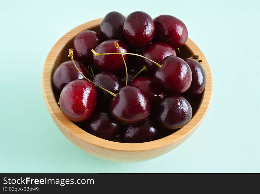 Cherries in a wooden bowl