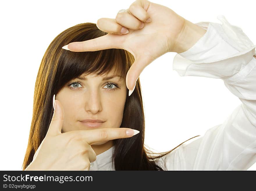 Young businesswoman looks through a frame made of hand. Young businesswoman looks through a frame made of hand