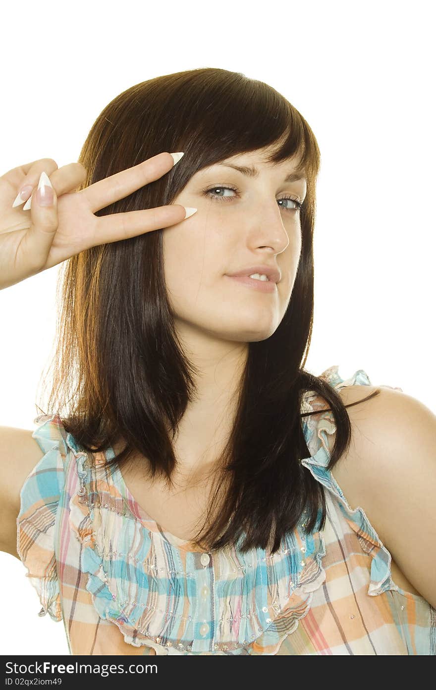 Portrait of a young girl on a white background. Two fingers of his hands around his eyes. Portrait of a young girl on a white background. Two fingers of his hands around his eyes