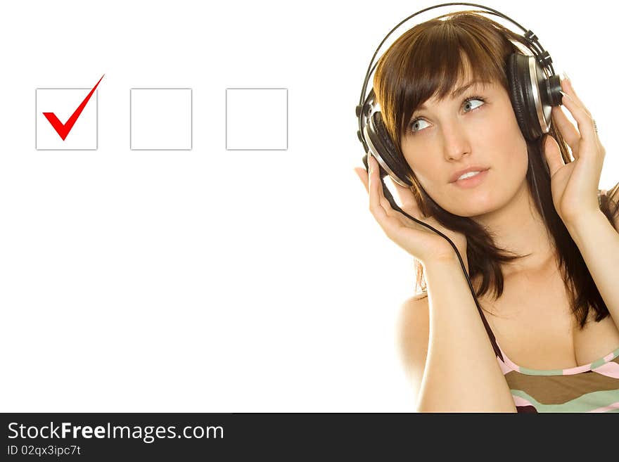 Marking in a Checkbox. Young woman with headphones makes a choice. Marking in a Checkbox. Young woman with headphones makes a choice