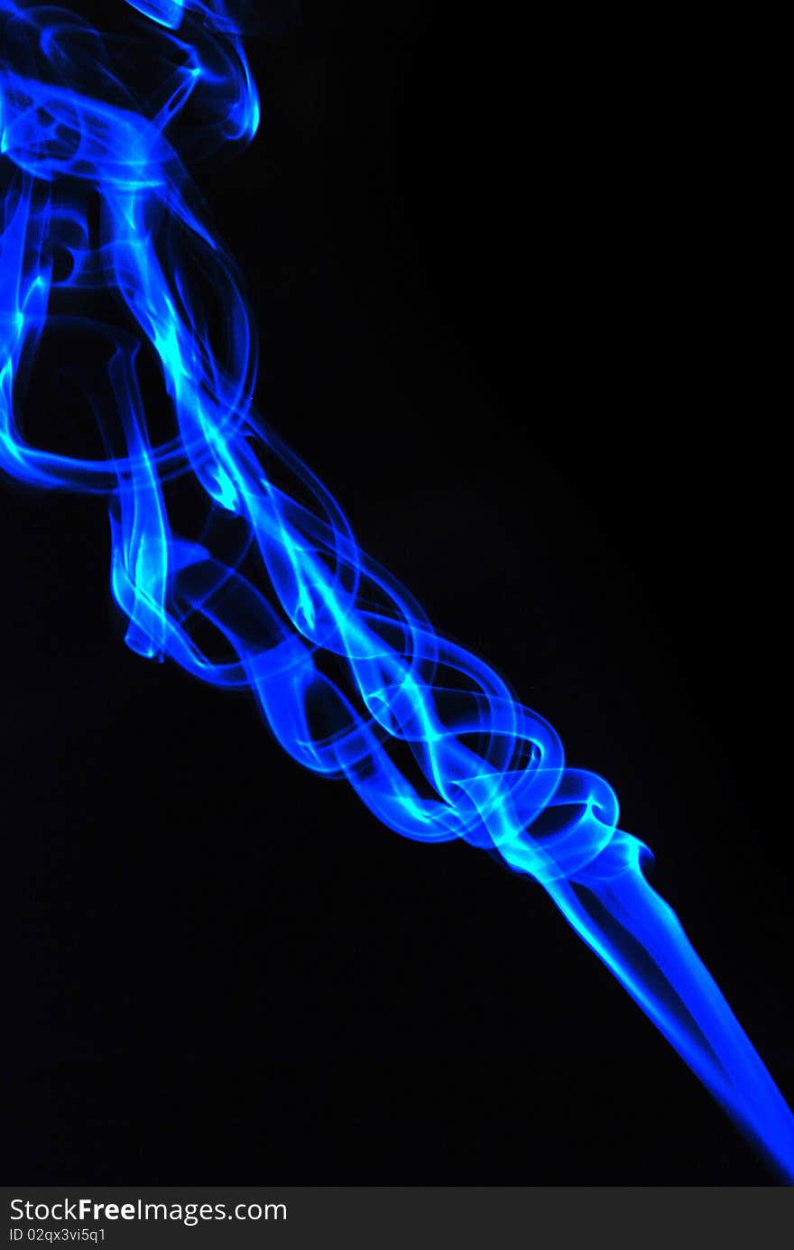 Abstract image of smoke rising isolated against black background