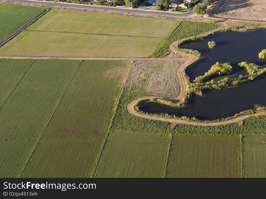 Aerial View Of Fields Bordering Subdivision