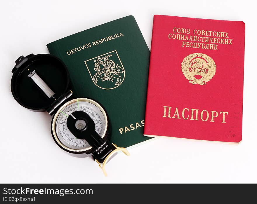 Soviet and Lithuanian passports with compass. Concept of immigration and traveling. Soviet and Lithuanian passports with compass. Concept of immigration and traveling.