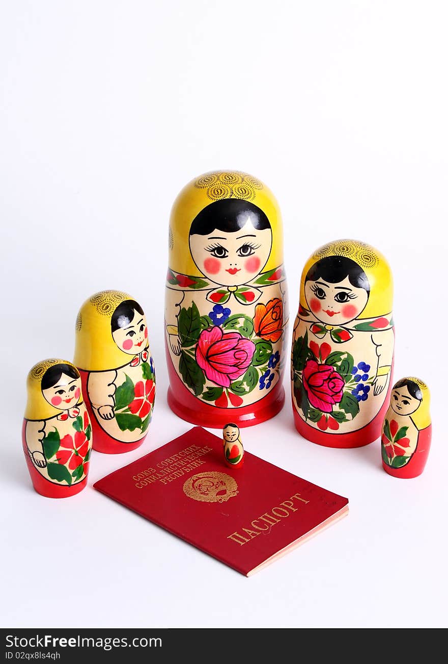 Matryoshka dolls family surrounding USSR passport