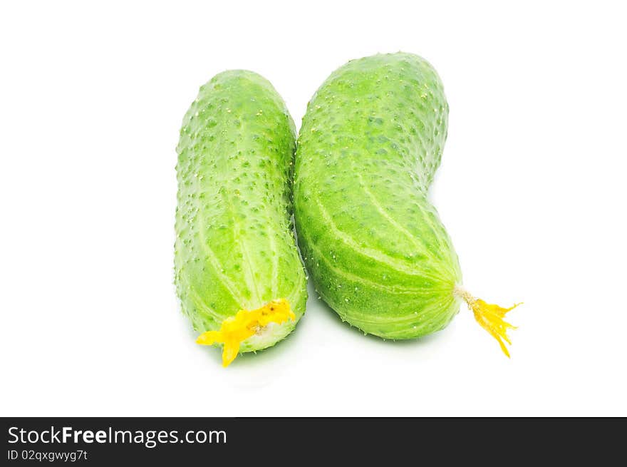 Two fresh green cucumbers isolated over white