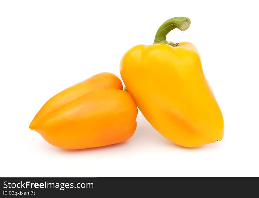 A pair of juicy ripe yellow peppers. A pair of juicy ripe yellow peppers