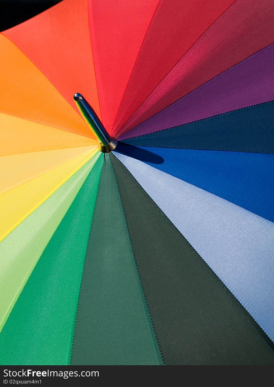 Details of an umbrella with rainbow colors