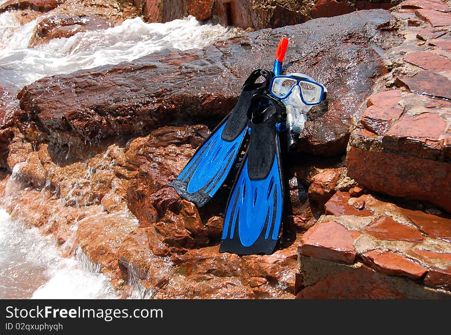 Snorkeling Set On A Rocky Beach