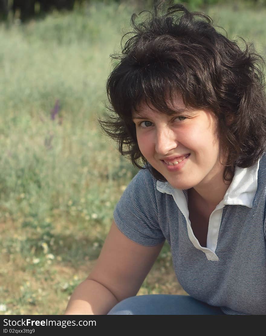 A young woman on the meadow