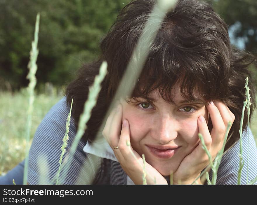 A young woman on the meadow