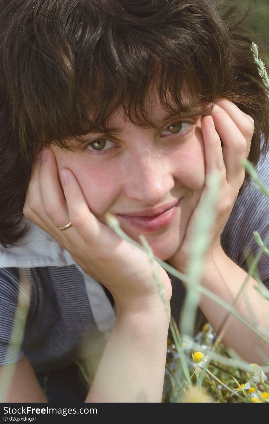 A young woman on the meadow