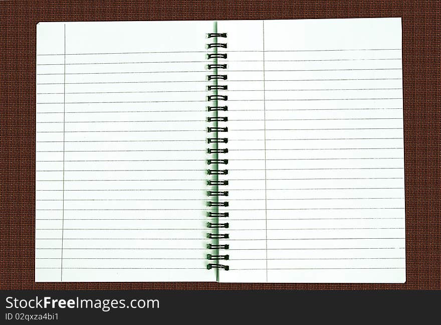 Blank notebook on textured background. Blank notebook on textured background.