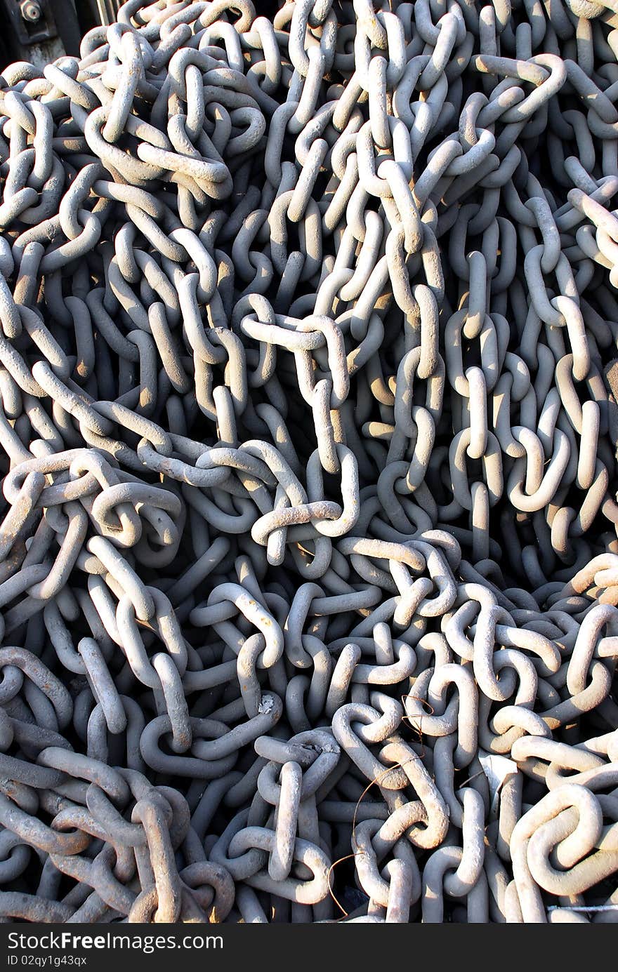 Pile of rusted chains at a boatyard. Pile of rusted chains at a boatyard